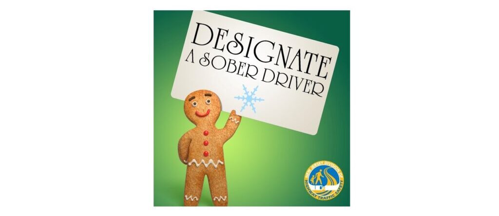 Gingerbread man holding designated driver sign.