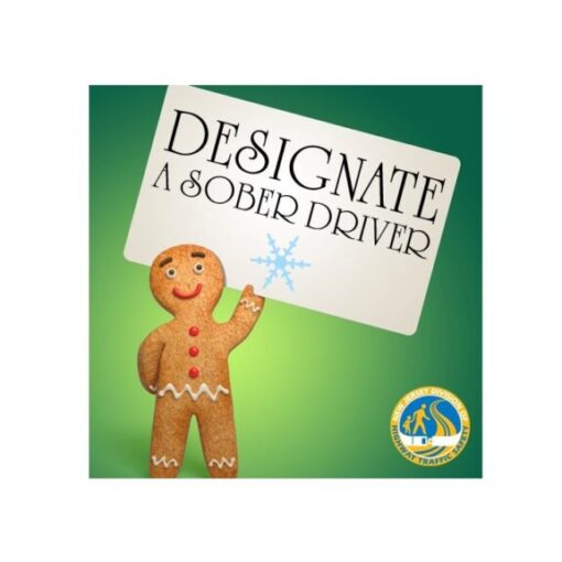 Gingerbread man holding designated driver sign.